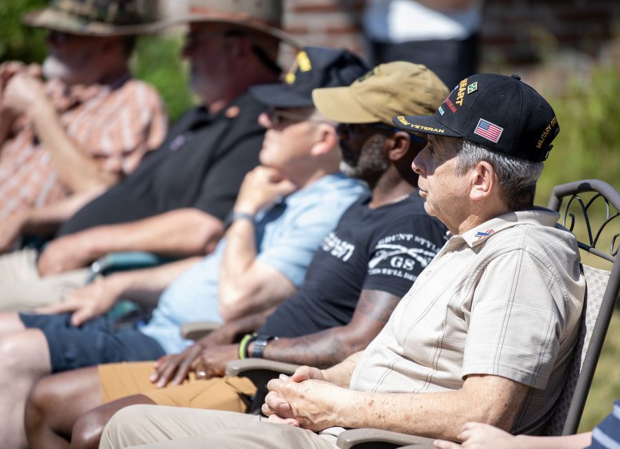 People listen to speakers during a groundbreaking ceremony Tuesday for America for Veterans Foundation’s housing project, Veterans Village. (Taylor Balkom/The Columbian)