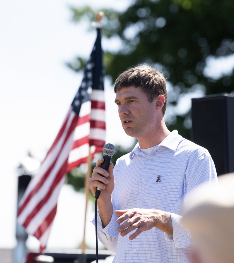 Wolf Industries owner Derek Huegel speaks Tuesday during the groundbreaking ceremony. The company will build the housing units for Veterans Village.