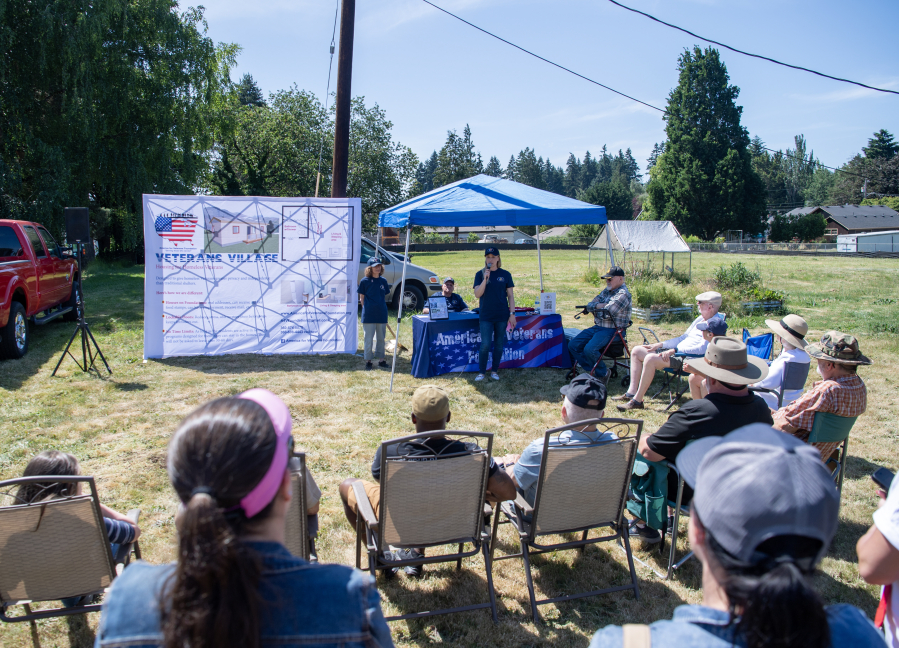 A crowd listens to America for Veterans Foundation board member Ingrid Friedberg speak on June 10, 2025, during a groundbreaking ceremony for America for Veterans Foundation’s 32-unit residential community for women veterans. (Photos by Taylor Balkom/The Columbian)