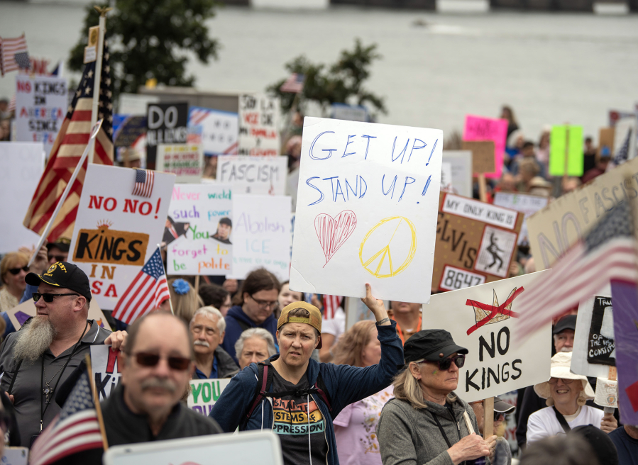 Protesters participate in the nationwide “No Kings” rally on Saturday, June 14, 2025, on Waterfront Way at the Vancouver waterfront.