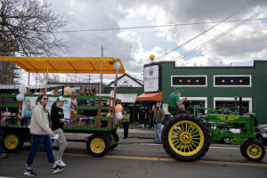 Members of Support For Early Learning & Families take part in the annual Paddy Hough Parade in Uptown Village on March 17. The nonprofit is a local affiliate of Dolly Parton’s Imagination Library serving Clark, Skamania and Klickitat counties. The state’s Office of Superintendent of Public Instruction will fund the program for a year after the Legislature cut its funding. (Amanda Cowan/The Columbian files)