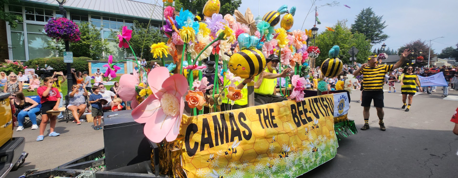 The Camas Lions Club’s “Camas the Bee-utiful” float entertains onlookers during the 48th annual Camas Days Grand Parade on July 27, 2024. (Contributed by the Downtown Camas Association)