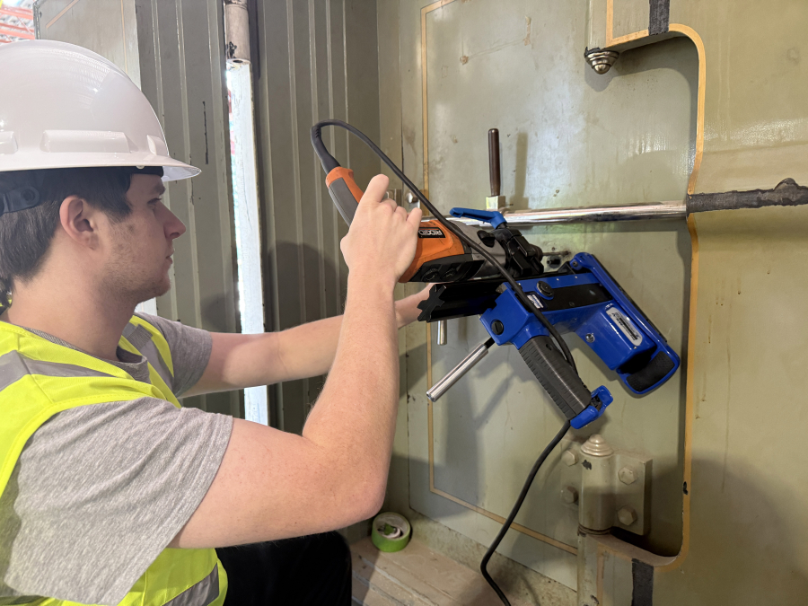 Aidan McOmie, Dave McOmie’s son, did the hard work of drilling through the inner door and “scoping” its rare five-tumbler combination lock. (Photos contributed by Dave McOmie)