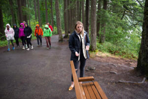 Luba Ross of Camas stands on the Round Lake trail in Camas on June 20, near the spot where, on July 28, 2024, she discovered a Vancouver man who had been missing for two days. Ross received the Camas Police Department’s 2025 Civilian Service Award for reuniting the man with his family. (James Rexroad/for The Columbian)