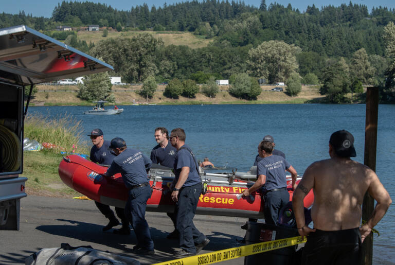 Officials return a boat to land after responding to the report of a drowning at Horseshoe Lake Park in Woodland on Monday afternoon.