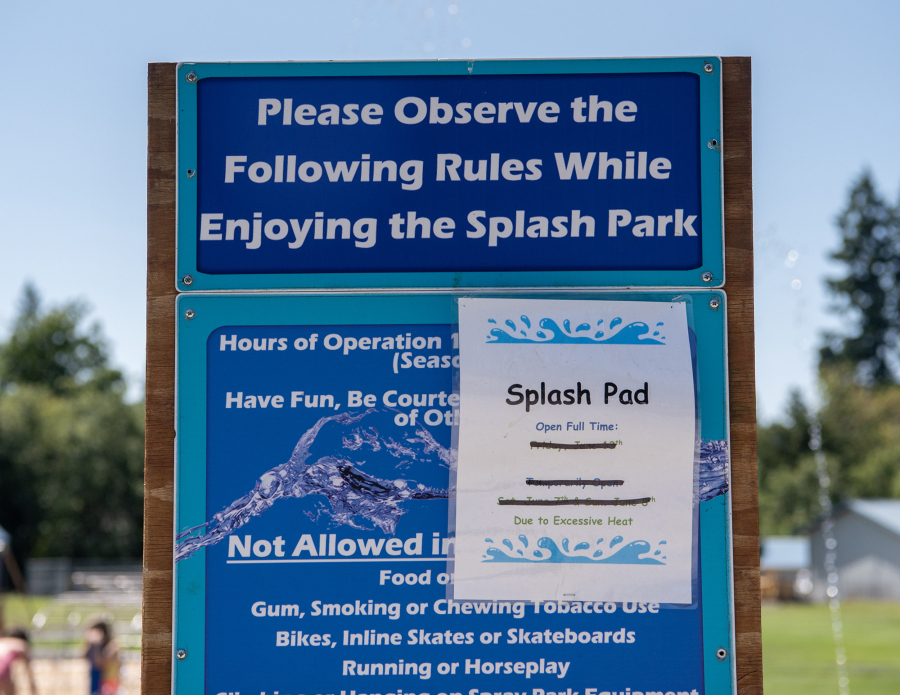 A sign shows rules and regulations around the splash pad Tuesday at Holley Park in La Center.
