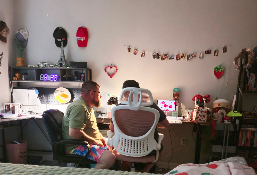 Washougal School District 
 Washougal resident Jon James (left) helps his son, Washougal Learning Academy student Regan James, with an assignment in an undated photo.