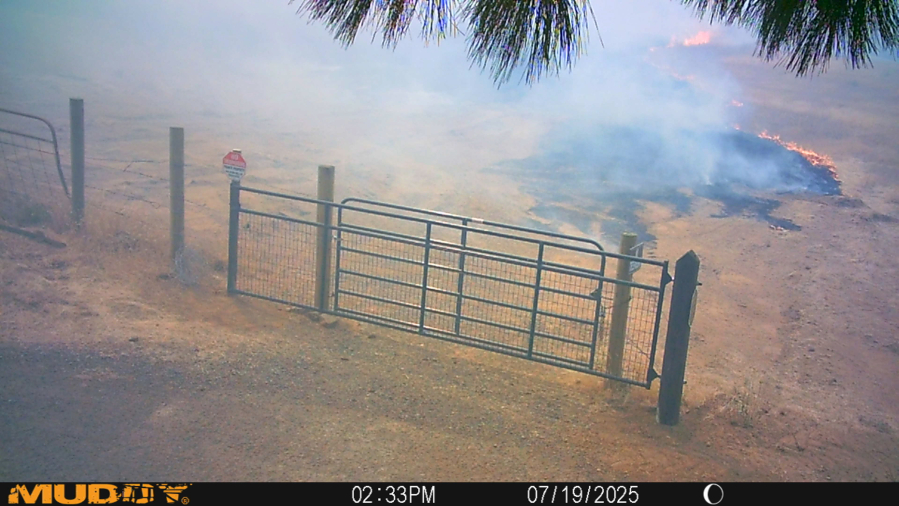 Fire burns toward the Columbia Grange Hall near Lyle as the Burdoin Fire burned through the Columbia River Gorge. The Grange hall was saved thanks to the hard work of Lyle resident Charlie Deach. (Contributed by the National Grange)
