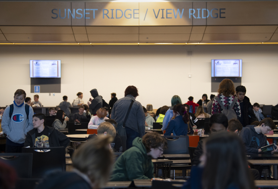Students gather in the cafeteria at View Ridge Middle School in Ridgefield before class in 2022. Ridgefield is among the smaller school districts in Clark County revising its cellphone policy for students. (Amanda Cowan/The Columbian files)