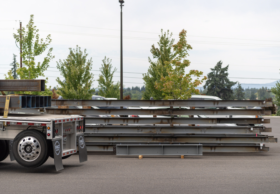 Steel structures sit in a parking lot Wednesday at Red Dog Fabrication in Ridgefield. The Discovery Corridor, first designated in 1999, continues to grow slowly. (Taylor Balkom/The Columbian)
