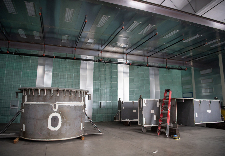 Steel structures wait to be painted Wednesday at Red Dog Fabrication in Ridgefield. The Discovery Corridor, first designated in 1999, continues to grow slowly. (Taylor Balkom/The Columbian)