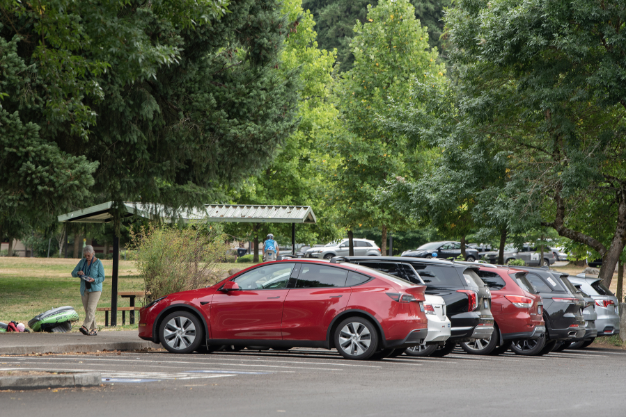 Cars fill the parking lot at Heritage Park in Camas on July 31. The city of Camas has signed a three-year contract with Placer.ai, a data company city leaders hope will provide them with a better idea of how many people attend city events and visit Camas&rsquo; parks, trails and other public amenities. (Amanda Cowan/The Columbian)