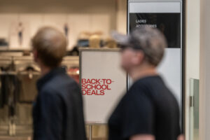 Shoppers pass the entrance of H&M inside Vancouver Mall on Wednesday. The National Retail Federation found half of back-to-school shoppers surveyed were starting shopping early out of concern about how tariffs would impact their shopping for the school year.