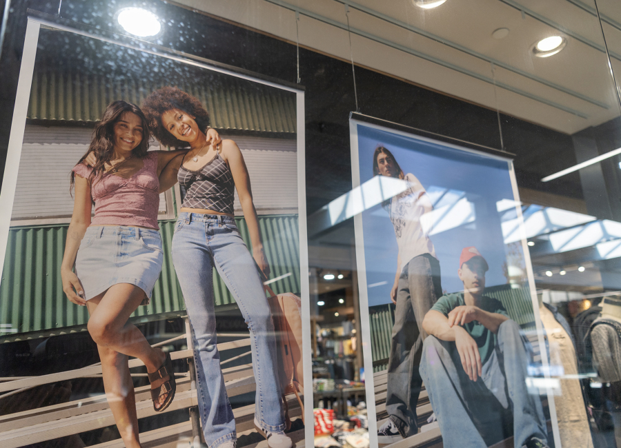 The window of Tilly&rsquo;s inside Vancouver Mall displays advertising on Wednesday. (Taylor Balkom/The Columbian)