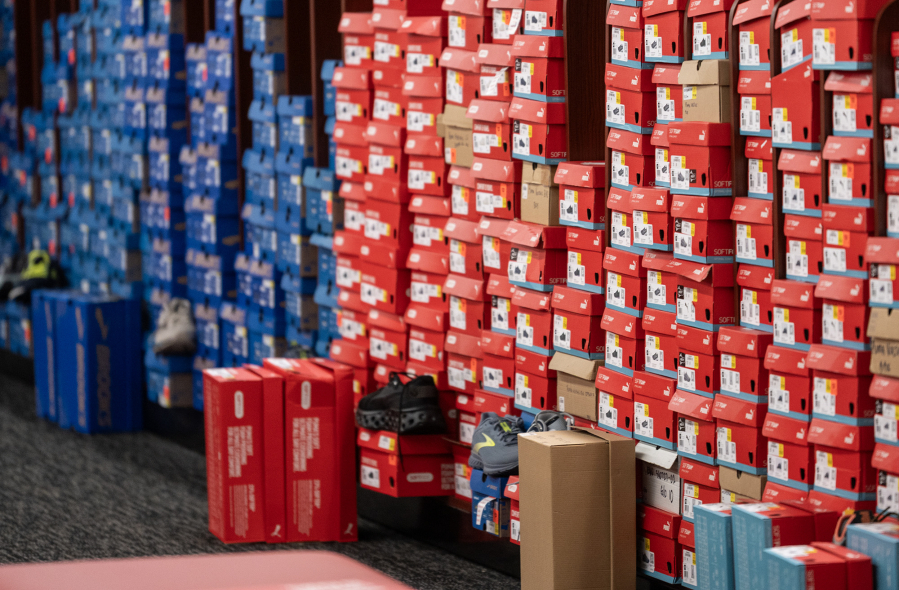 Shoes line shelves at Shoe Dept. Encore at the Vancouver Mall on Wednesday.