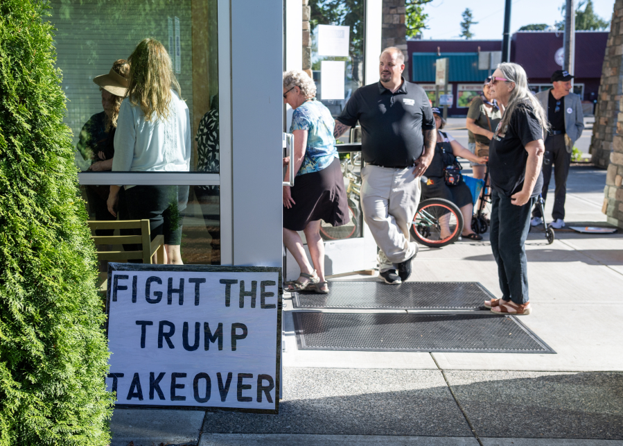 A sign sits outside the Battle Ground Event Center on Wednesday ahead of a town hall with U.S. Rep. Marie Gluesenkamp Perez, D-Skamania. A sign posted to the event center doors warned visitors that political signs would not be allowed inside the official event. (Photos by Taylor Balkom/ The Columbian)