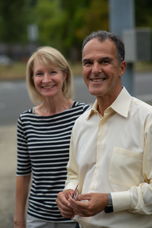 Camas residents Randy and Karin Nosrati stand near the corner of Northeast 13th Street and Northwest Friberg-Strunk Street in northeast Camas on Friday. A Clark County Superior Court judge ruled in favor of a group of Camas residents, who sued the city of Camas over a permit given to new construction of a gas station in their neighborhood.