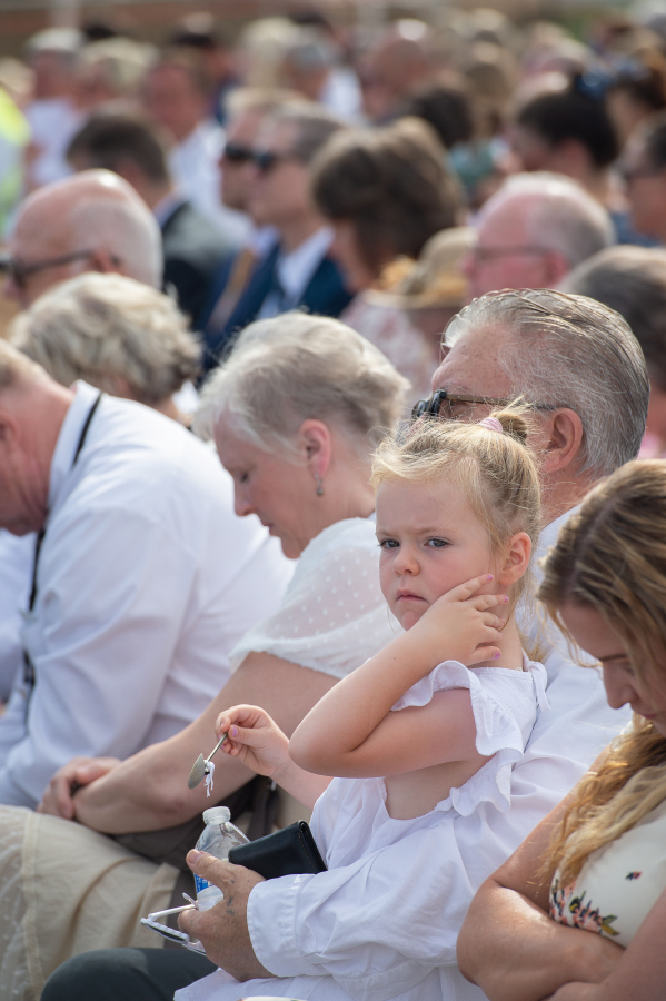 Olivia Stzateichuk, 4, of Vancouver, plays with a memorial shovel during the ceremony. The Church of Jesus Christ of Latter-day Saints held a groundbreaking ceremony for the Vancouver Washington Temple, the sixth temple in Washington. The temple will be built on a 15.11-acre plot on the Vancouver-Camas border. It will be 43,000 square feet, and several stories tall. (James Rexroad/for The Columbian)