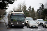 A C-Tran bus joins a crowd of motorists while waiting at a red light at the intersection of Southeast Hearthwood and Mill Plain boulevards in February. Clark County&rsquo;s small cities are questioning whether they get their money&rsquo;s worth out of C-Tran. (Amanda Cowan/The Columbian files)