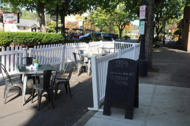 The original parklet outside Feast 316, which featured a white picket fence and tables, is pictured Oct. 9, 2020.