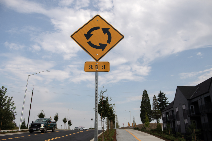 A sign notifies drivers of an upcoming roundabout as construction work on Southeast First Street between Southeast 177th and 192nd avenues is finally finished and the road has reopened. (Amanda Cowan/The Columbian)