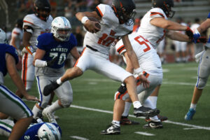 Washougal senior Hunter Miller (10) leaps over a Mountain View defender during a non-league game Thursday. (Tim Martinez/The Columbian)