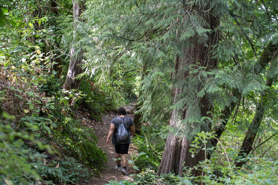 A visitor hikes near East Biddle Lake in Vancouver on Monday morning. Clark County purchased the property through its Legacy Lands program. (Photos by Amanda Cowan/The Columbian)