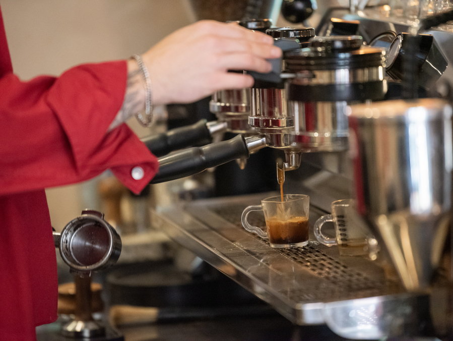 Manager Tiernan Stanley pulls a shot of espresso Monday at Compass Coffee Roasting in Washougal.