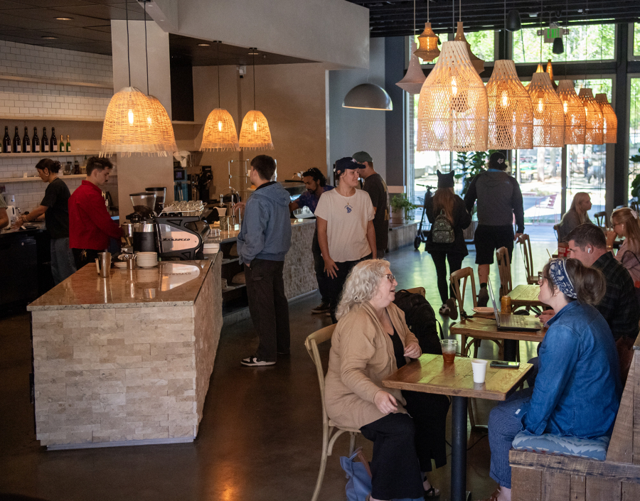 Customers visit Compass Coffee Roasting on Monday in Washougal. It has filled the void left by Washougal Coffee Company, which permanently closed earlier this month. (Photos by Taylor Balkom/The Columbian)