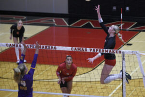 Camas senior Ella Thompson, right, leaps toward the ball during a non-league volleyball match against Columbia River on Monday, Sept. 22, 2025 at Camas High School. (Micah Rice/The Columbian)