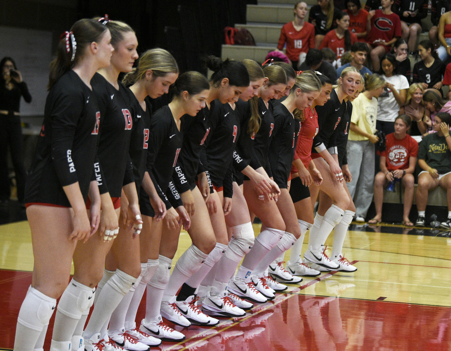 The Camas volleyball team steps onto the court after introductions before a non-league match against Columbia River on Monday, Sept. 22, 2025 at Camas High School. (Micah Rice/The Columbian)