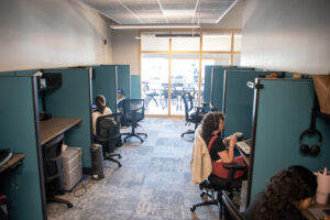 Gemma Somol takes calls at Council for the Homeless in Vancouver. The Housing Hotline is located inside the Council for the Homeless office and helps residents connect to resources. (Taylor Balkom/The Columbian files)