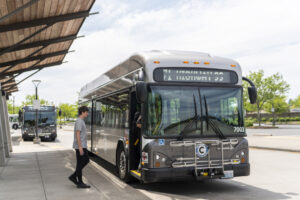 Commuters step onto a new, fully electric C-Tran bus on June 7 at the 99th Street Transit Center in Vancouver. C-Tran told a Thurston County Superior Court judge this week that the potential loss of state grant funding due to a dispute over the transit agency’s board representation could force C-Tran to delay or defer purchasing electric buses. The agency hopes to have a zero-emissions fleet by 2040. (Taylor Balkom/The Columbian files)