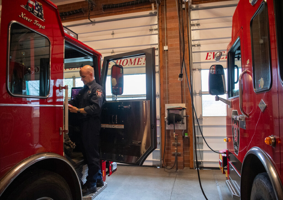 Capt. James Tierney stands in the front door of a fire engine March 21 at Camas Fire Station 42. (Taylor Balkom/The Columbian files)