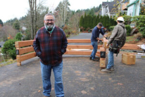 Randal Friedman stands near the solar canopy being constructed in the front yard of his Camas home on Nov. 18, 2019. (The Columbian files)