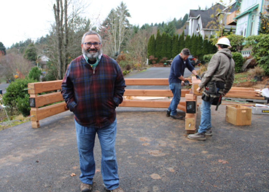 Randal Friedman stands near the solar canopy being constructed in the front yard of his Camas home on Nov. 18, 2019. (The Columbian files)