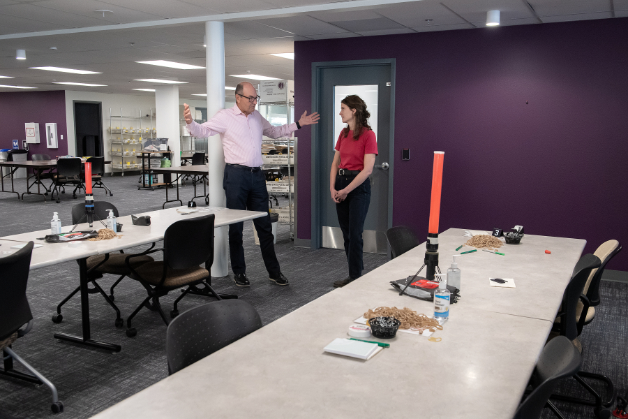 U.S. Rep. Marie Gluesenkamp Perez, D-Skamania, and Clark County Auditor Greg Kimsey talk about the process of verifying and counting mail-in ballots during a tour of the Clark County Elections Office in downtown Vancouver on Wednesday afternoon. (Amanda Cowan/The Columbian)