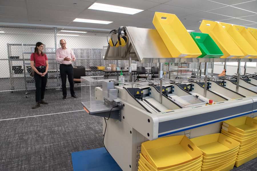 U.S. Rep. Marie Gluesenkamp Perez, D-Skamania, left, talks with Clark County Auditor Greg Kimsey during a tour at the elections office in downtown Vancouver on Sept. 24. Perez said she supports mail-in voting, calling it “the gold standard in election security” among voting methods in the United States. (Photos by Amanda Cowan/The Columbian)