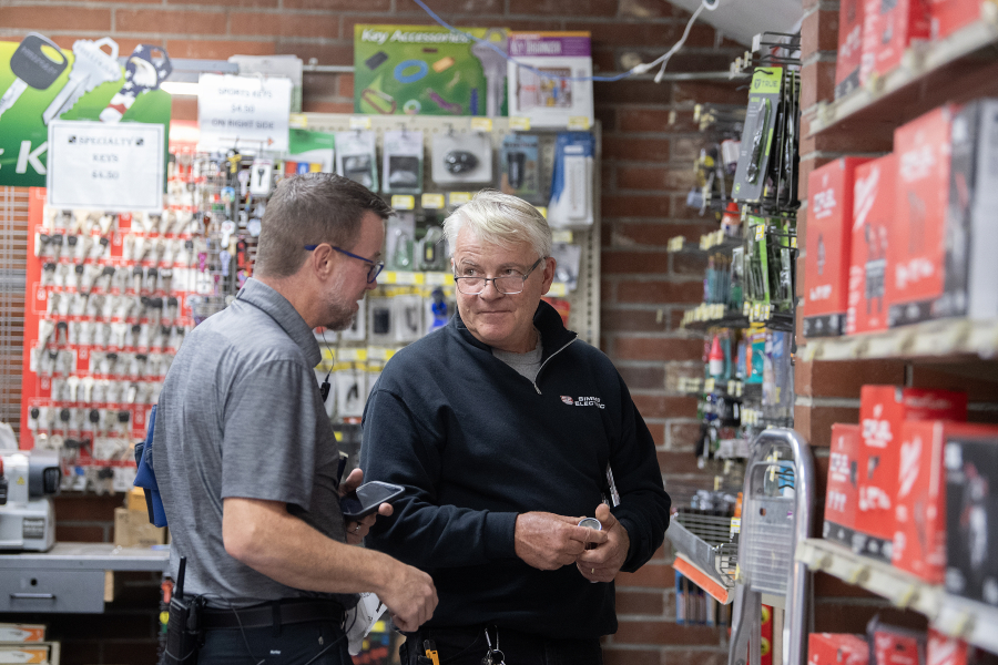 Aaron Lutz of Lutz Hardware, left, helps customer David Simms of Simms Electric in Camas on Monday afternoon. (Amanda Cowan/The Columbian)