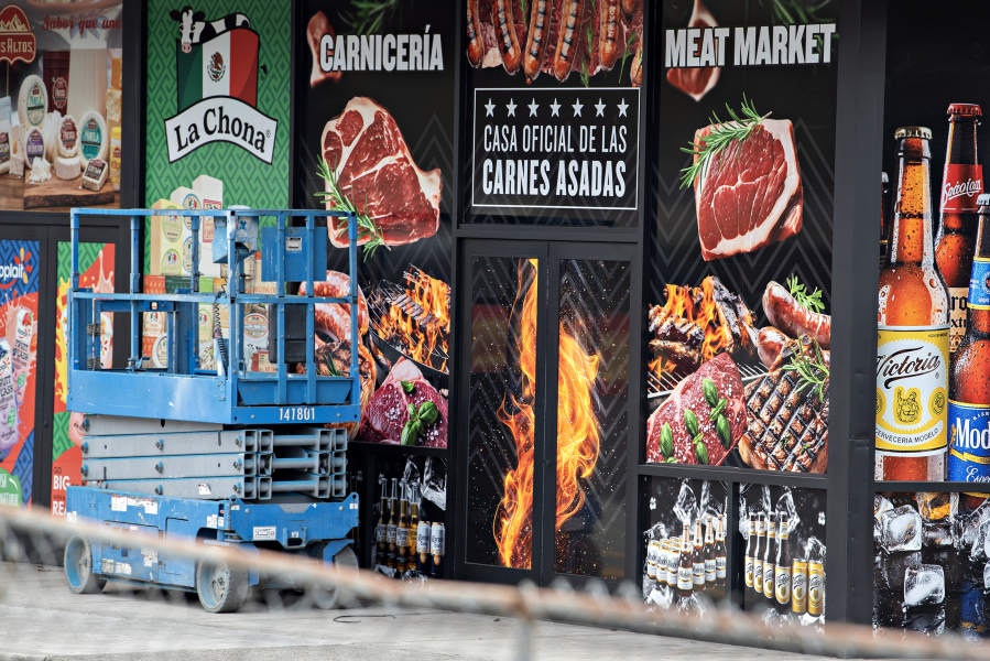 A sign on the outside of La Tapatia Mexican Super Market advertises steak. Although retail prices have risen, beef remains a staple of the American diet. (Amanda Cowan/The Columbian)