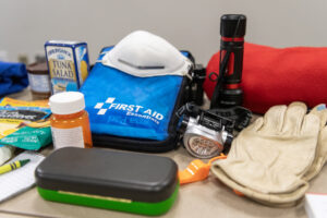 Emergency supplies typically found in “go bags” sit on a table Tuesday at Clark Regional Emergency Services. (Taylor Balkom/The Columbian)