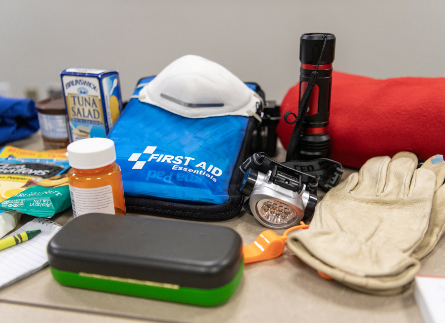 Emergency supplies typically found in &ldquo;go bags&rdquo; sit on a table Tuesday at Clark Regional Emergency Services. (Taylor Balkom/The Columbian)