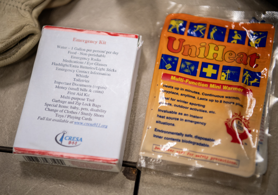 Emergency supplies typically found in “go bags” sit on a table Tuesday at Clark Regional Emergency Services. (Taylor Balkom/The Columbian)