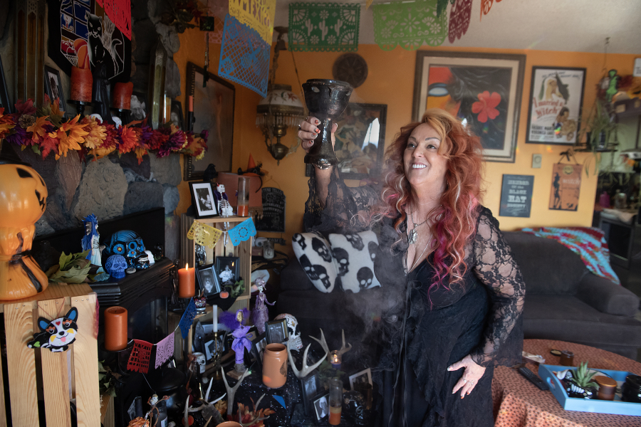 Angel Biederbeck, high priestess of the Columbia River Witches Collective, cleanses her Samhain altar with copal, a tree resin used as incense. Biederbeck will lead a Samhain celebration on Oct. 30 at the Camas store Vampire Unicorns. (Photos by Amanda Cowan/The Columbian)