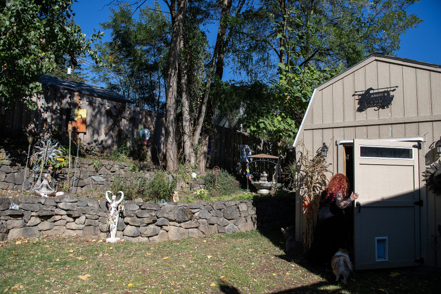 High Priestess Angel Biederbeck of the Columbia River Witches Collective hosts some ceremonies and rituals in her backyard. Here, she’s entering her art studio, where she creates felted art and paintings and works on traditional pagan crafts. (Amanda Cowan/The Columbian)