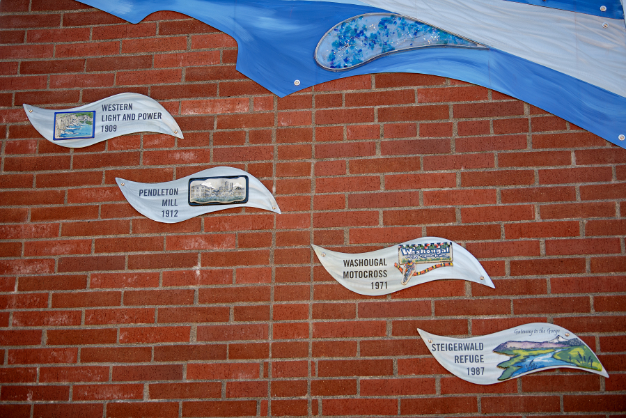 Washougal’s newest piece of public artwork, installed on the campanile at Reflection Plaza, depicts key events from Washougal’s history. (Amanda Cowan/The Columbian)
