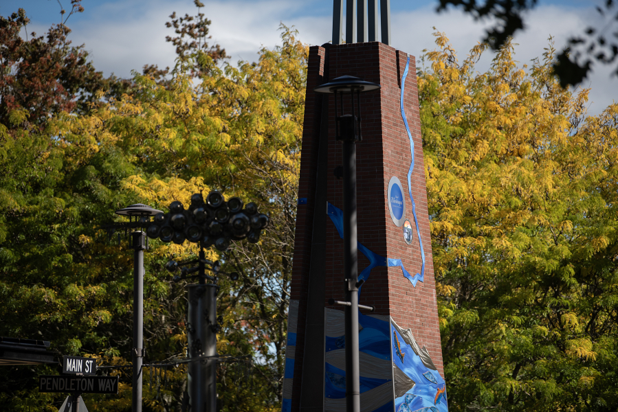 Washougal’s newest piece of public artwork, installed on the campanile at Reflection Plaza, depicts the city’s location at the confluence of the Columbia and Washougal rivers. (Amanda Cowan/The Columbian)