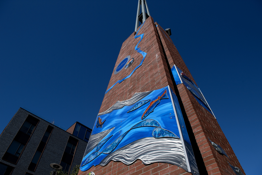 Light reflects off Washougal’s newest piece of public artwork, installed on the campanile at Reflection Plaza. (Amanda Cowan/The Columbian)