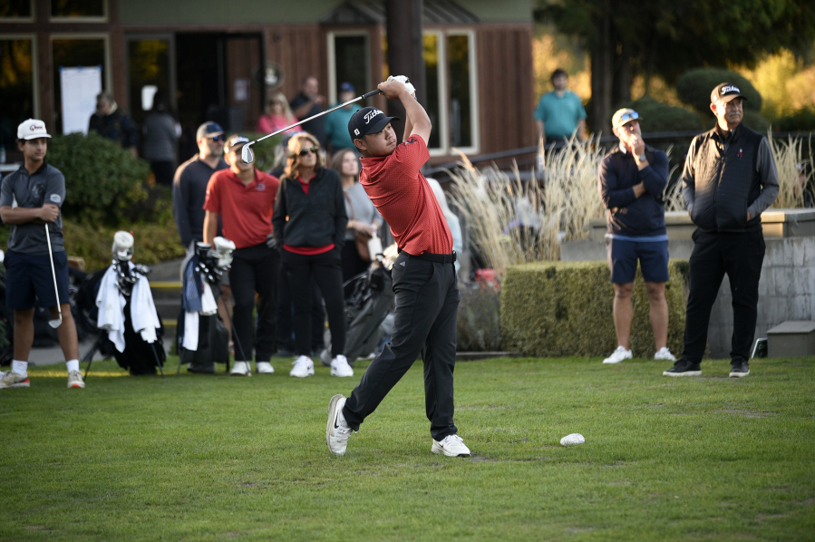 Ryker Jun of Camas hits a tee shot on the No. 1 hole at Lewis River Golf Course to start the playoff against teammate Collin Clark. Both had scores of 150 for 36 holes. (Tim Martinez/The Columbian)