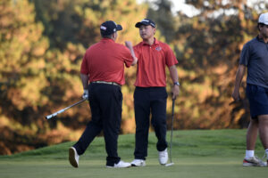 Ryker Jun, right, of Camas is congratulated by teammate Collin Clark after Jun beat Clark in a one-hole playoff at the Class 4A boys golf district tournament Tuesday at Lewis River Golf Course. (Tim Martinez/The Columbian)